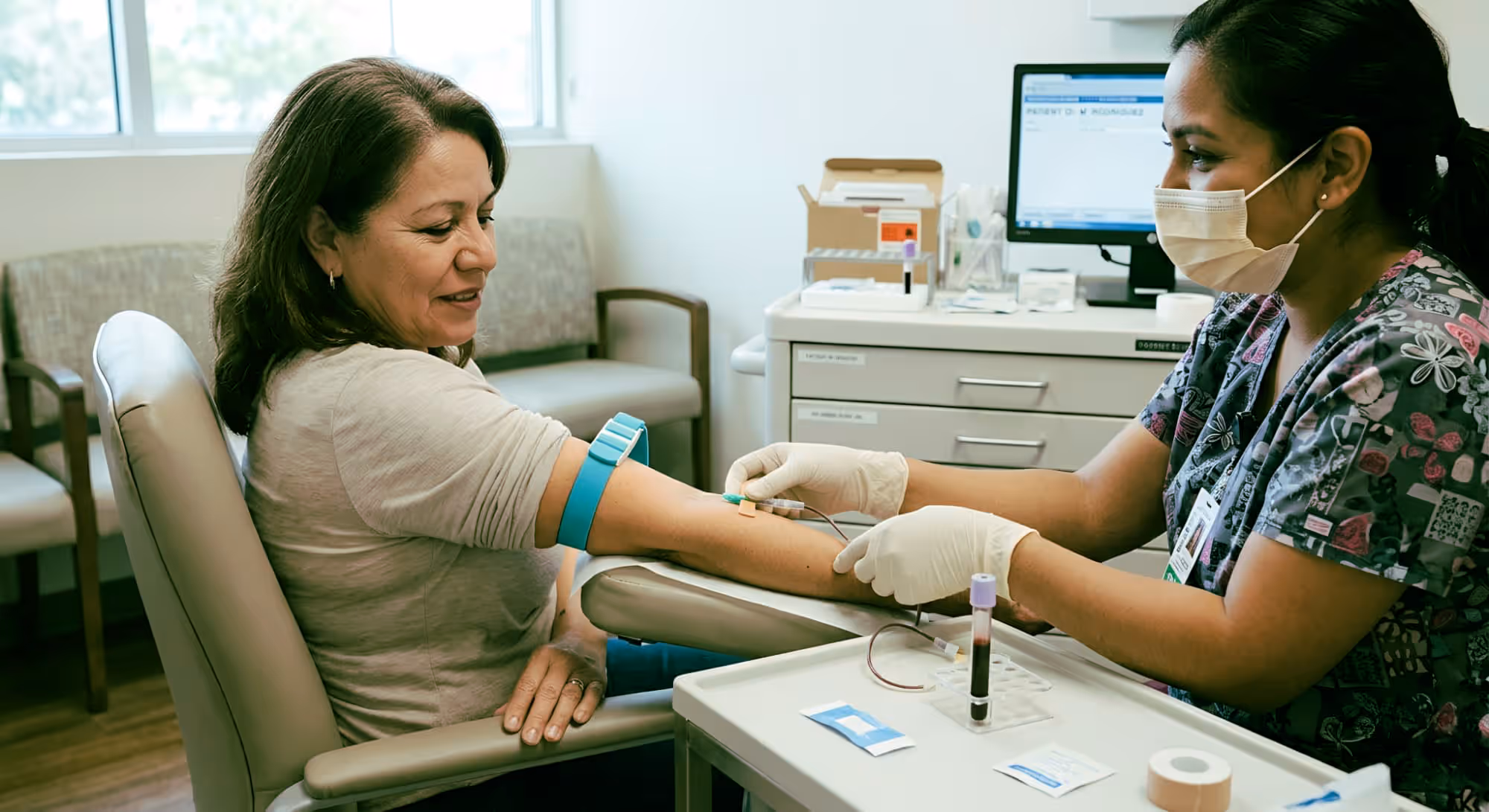 A nurse taking a blood sample from a patient.